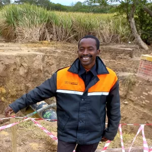 Bandile Sengane, one of the four security guards keeping an eye on the temporary pipeline in Tongaat, Durban, South Africa. Photo : Desiree Erasmus