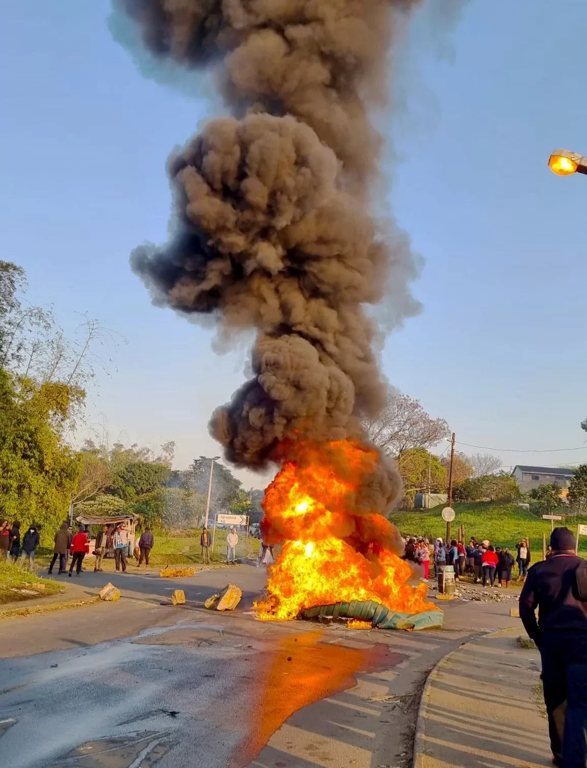 A torched water tank during a protest staged by residents of Tongaat and Hambanathi after more than 100 days without water following the devastating April floods. Photo : Don Perumal