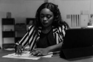 Photo by Tima Miroshnichenko: https://www.pexels.com/photo/woman-in-black-and-white-long-sleeve-shirt-sitting-at-the-table-5685975/